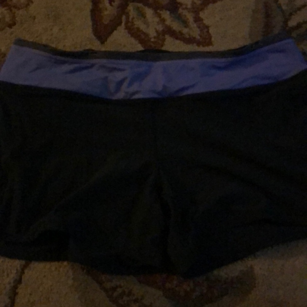 Lululemon size 8 Black/purple speed shorts GUC